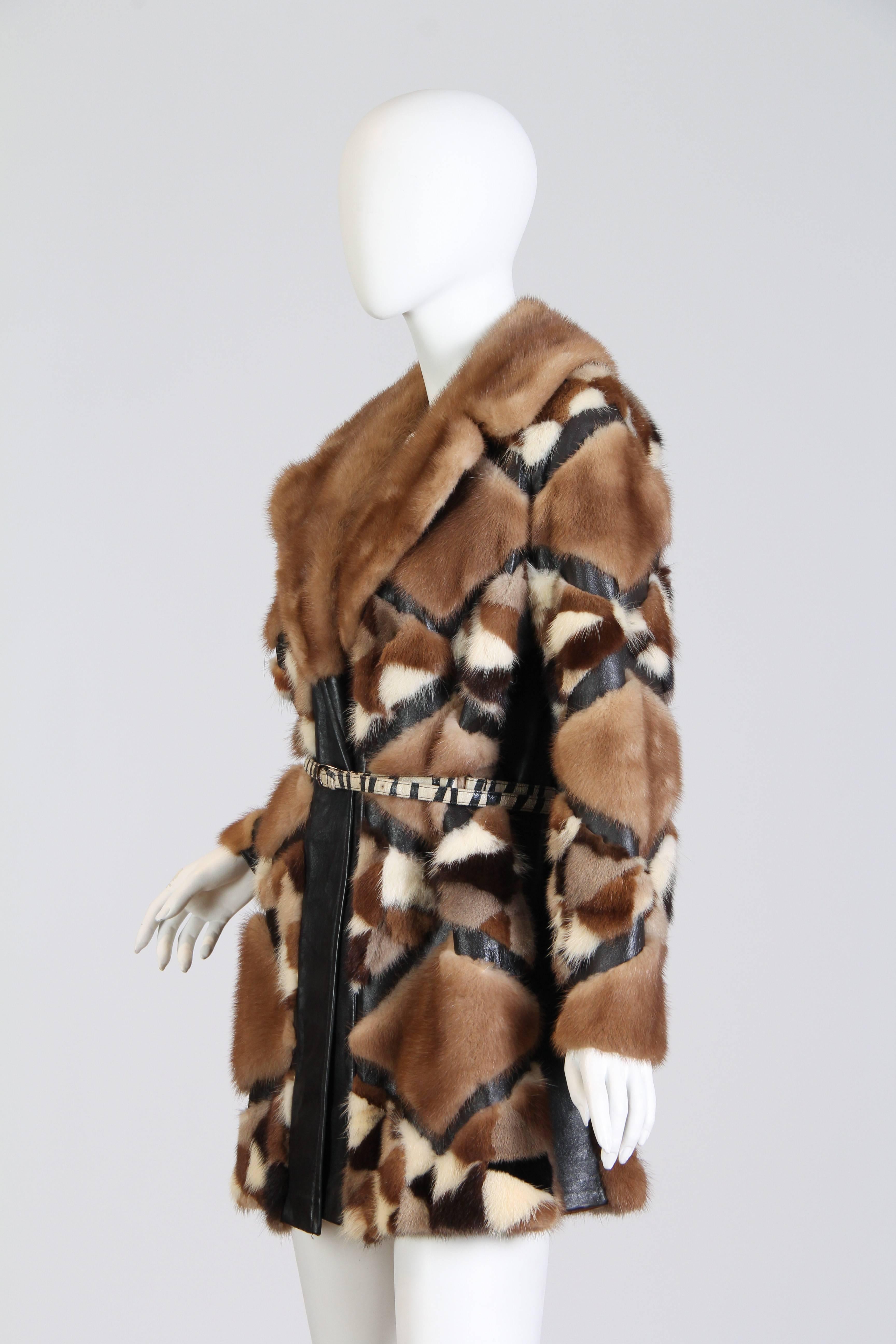 Gorgeous, rare, and cool. From that cherry spot of style from the late 1960s to the early 1970s. The condition on this coat is very good, both the fur and the leather are supple. The flaw is that it is missing its leather sash belt. We've shown it