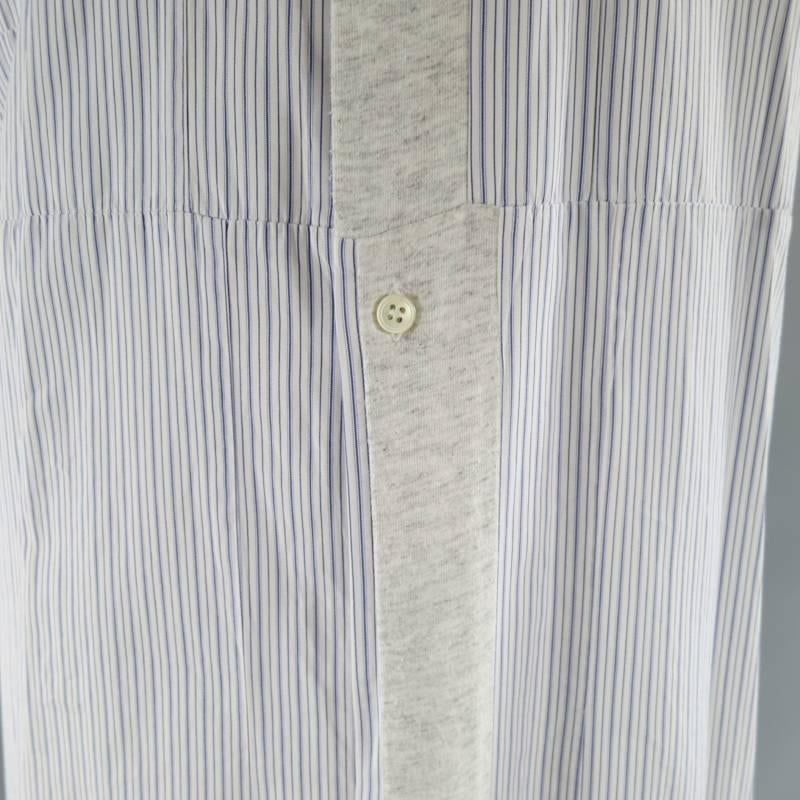 This unique COMME des GARCONS shirt comes in a classic blue and white striped cotton constructed in a square patchwork style and features a pointed collar, frontal chest patch pocket, back pleat, and light heather grey cotton jersey panels on the