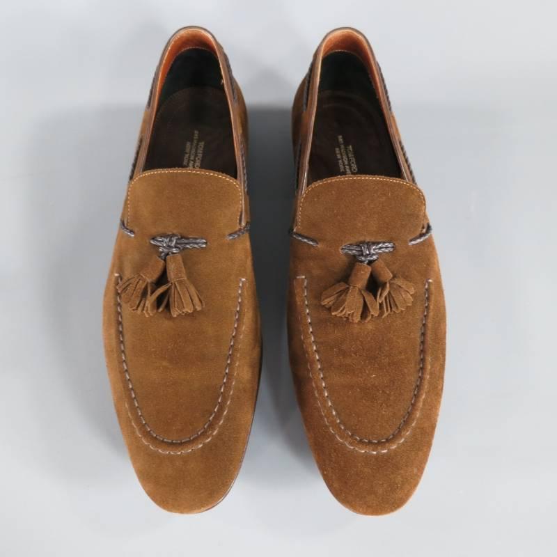 These dress loafers by TOM FORD come in a rich brown suede and feature a round pointed toe, top stitching, low brown heel, braided dark brown leather piping and a double tassel front. Made in Italy.
 
Very Good Pre-owned Condition.