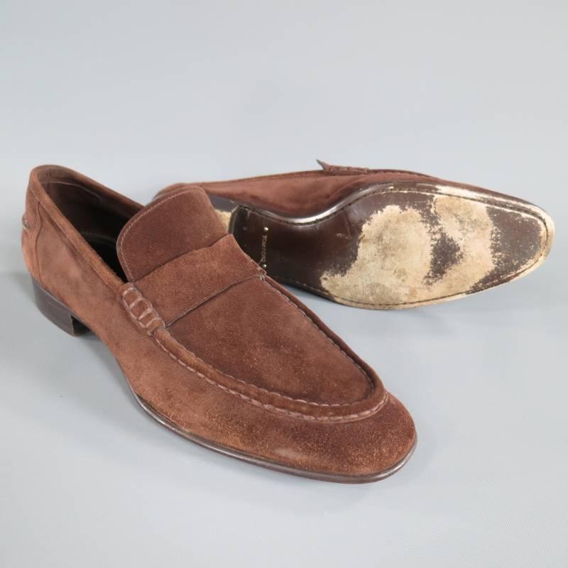 These slip on loafers by TOM FORD come in a rich chocolate brown suede and feature a round pointed toe with top stitch piping detail, penny loafer detail with no slot, and a one inch heel.  Made in Italy.
 
Good Pre-Owned Condition.
 
Retails at