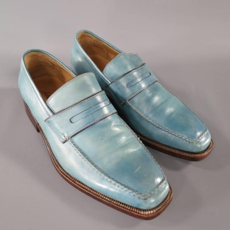 Sutor Mantellassi Loafers consists of leather material in a aqua color tone. Designed in a square-toe front, edge pipping surface with contrast white stitching throughout top and body of shoe. Penny loafer mid-section with stitch detail. Brown