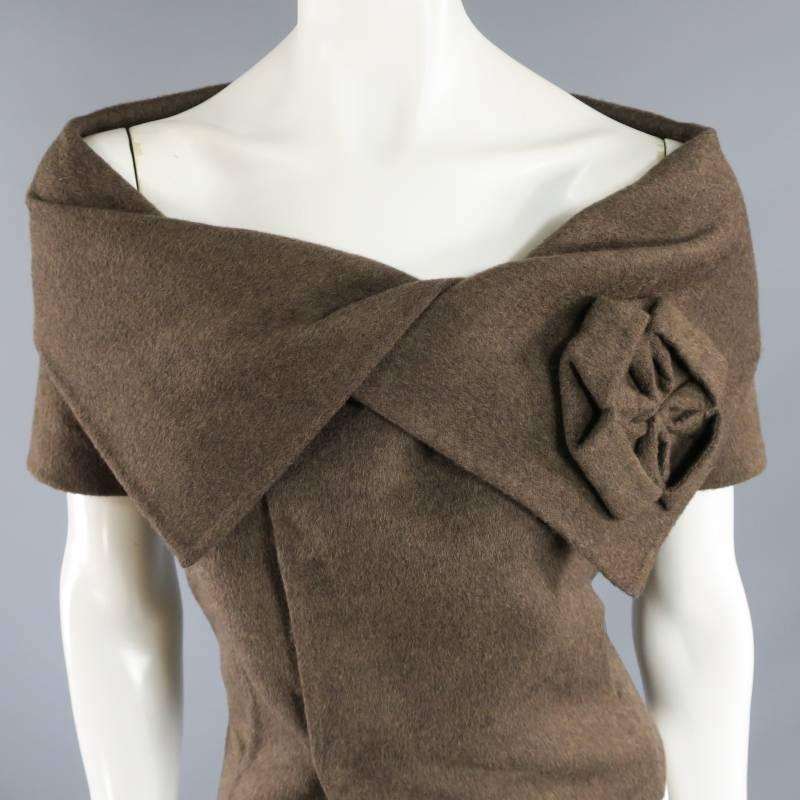 This rare and fabulous dress top by OSCAR DE LA RENTA comes in a taupe brown wool angora knit and features an off the shoulder portrait collar with structured flower aplique, double breasted snap closure and short sleeves. Great as a dramatic top or