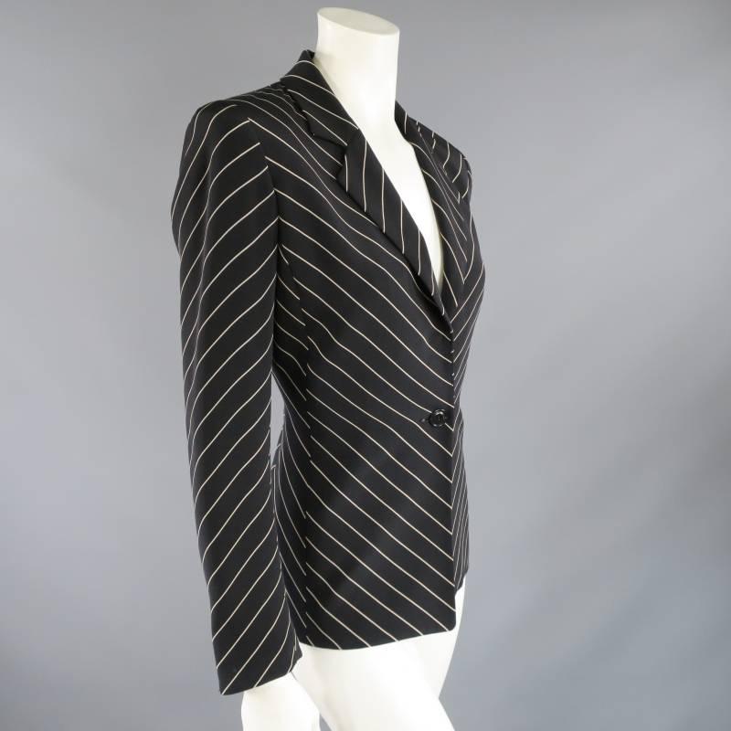 This vintage OSCAR by OSCAR DE LA RENTA blazer comes in a structured black and light beige pinstripe and features a notch lapel, snap and button closure, and a ventless back with V stripe detail.
 
Excellent Pre-Owned Condition.	Marked: 2
