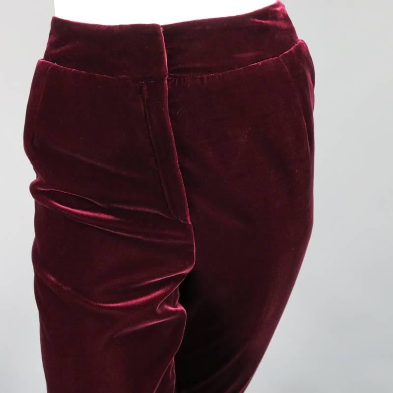 These gorgeous high rise dress pants by OSCAR DE LA RENTA comes in a luscious deep burgundy velvet and feature a thick waist band, zip fly, and tapered leg. Made in The USA.
 
Excellent Pre-Owned Condition.	Marked: 6
 
Measurements:
 
Waist: