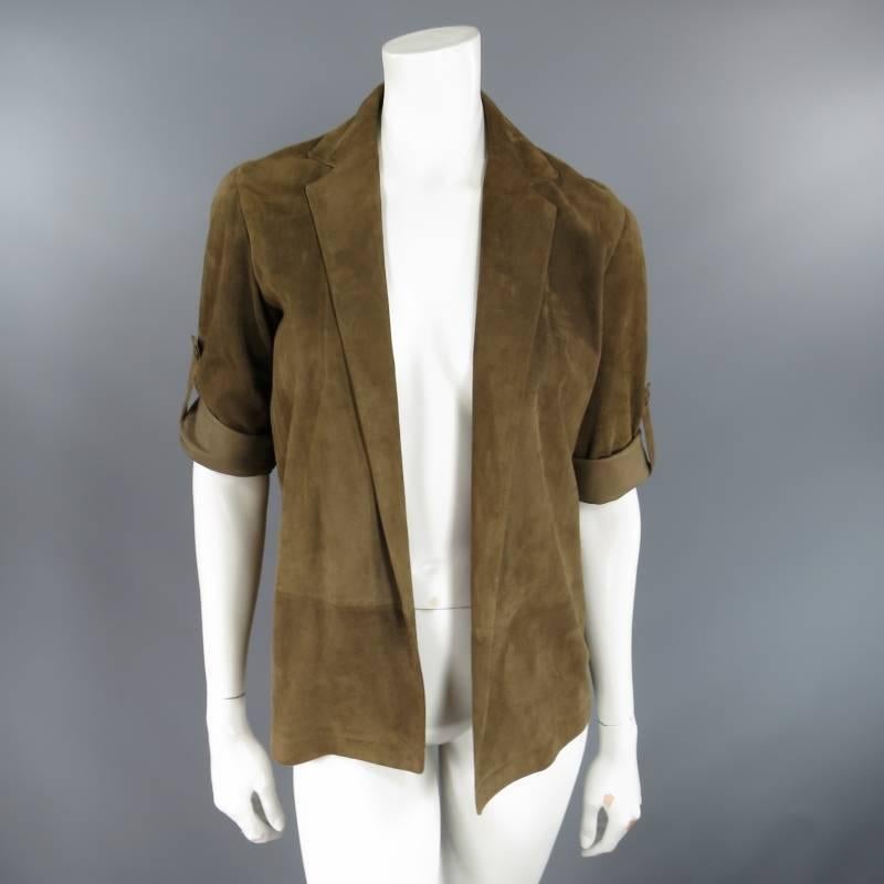 This gorgeous open front jacket by CELINE comes in a soft, light weight light brown suede and features a notch lapel and long sleeves with a roll tab detail. Made in Italy.
 
Excellent Pre-Owned Condition.	Marked: 36
 
Measurements:
