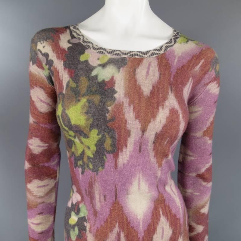 This lovely sweater dress by ETRO comes in a soft wool cashmere blend and features an all over distressed pink and red Ikat print with green floral details, a scoop neckline, and long sleeves with chevron printed cuffs. Made in Italy.
 
Excellent