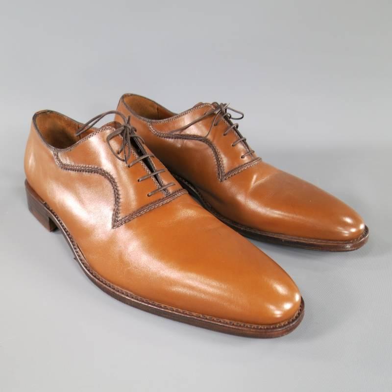 Beautifully smooth tan leather derby lace ups by A. TESTONI.  Pointed toe, darker toned double topstitching at lace placket makes for a nice design detail.  Wooden, leather stack heel and sole with TOPY rubber.  Made in Italy.
 
Excellent Pre-