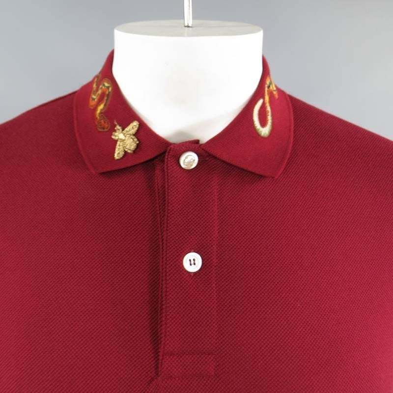 Brand New Gucci Short Sleeve Polo consists of cotton blend material in red color tone. Designed with Alessandro Michele's signature details, embroidered (orange snake) applique is applied along the collar with a gold embroidered bee detail, a new