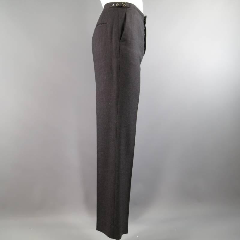 Louis Vuitton Dress Pants consists of wool material in a charcoal color tone. Designed with button-fly closure, side quarter pockets and adjustable side belts on waist with 