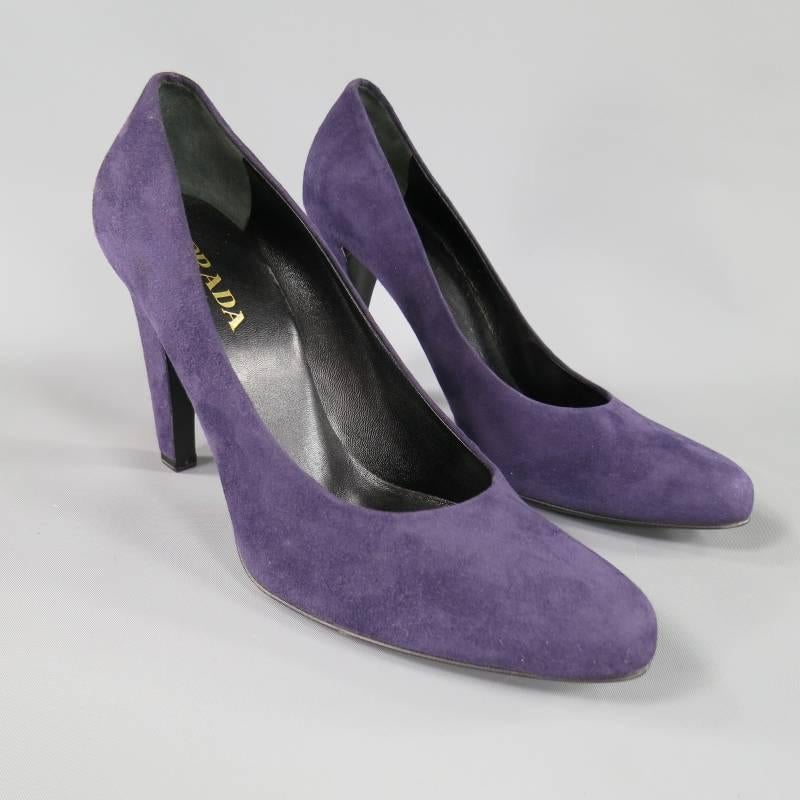 These gorgeous PRADA pumps come in a rich purple suede and feature a round pointed toe, and thick curved heel.Made in Italy.

Excellent Pre-Owned Condition.	Marked: 38.5

Measurements:

Heel: 4 in.
Width: 3.5 in.
Insole: 9 in.

Item ID: