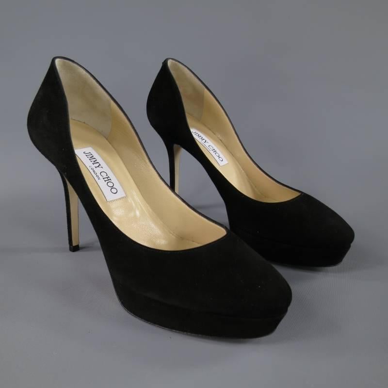 These fabulous JIMMY CHOO pumps come in a rich black suede nubuck and feature a round pointed toe with platform, and stiletto heel. Made in Italy.

Excellent Pre-Owned Condition.	Marked: 39

Heel: 4.5 in.
Platform: 1 in.
Width: 3 in.
Insole: