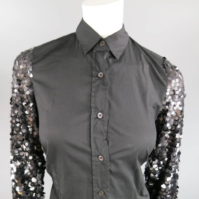 This fabulous DRIES VAN NOTEN shirt comes in a classic matte black cotton blend and features a pointed collar, bust darts, and payette sequin sleeves.
 
Very Good Pre-Owned Condition.	Marked: 38
 
Measurements:
 
Shoulder: 14 in.
Bust: 39