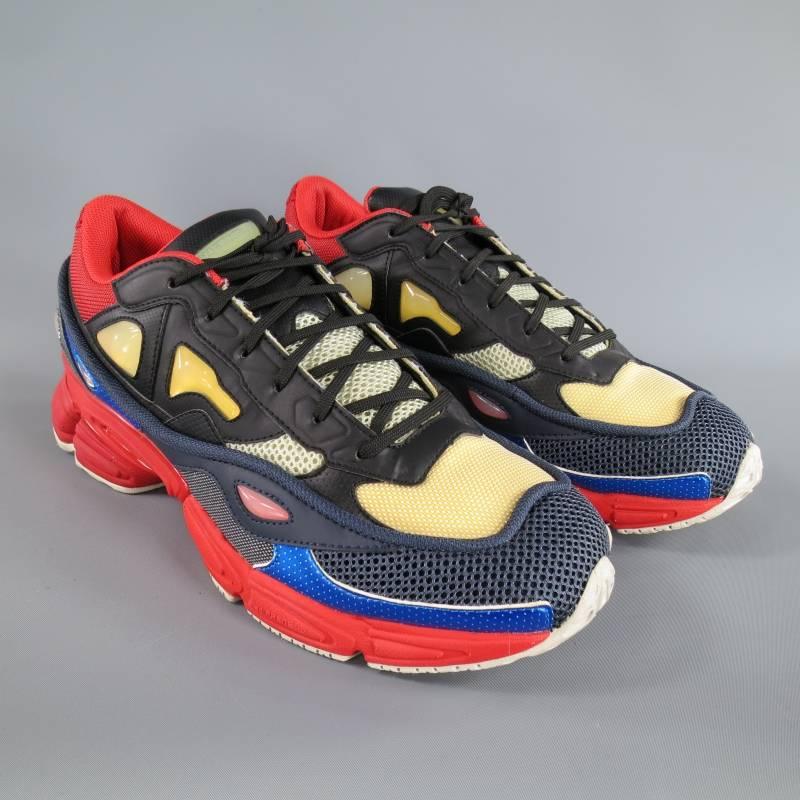 RAF SIMONS X ADIDAS Sneakers consists of nylon material in a multi-color tone. Designed in a running silhouette in the Ozweego 2.  Detailed with layered leather, mesh, and perforated synthetic uppers that are placed atop a solid red sole.
 
Good