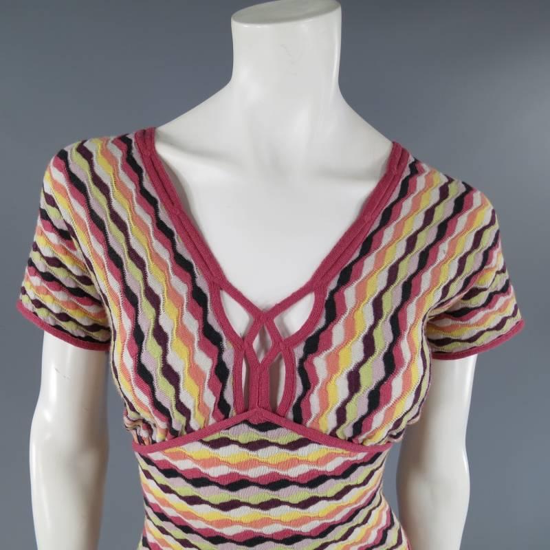 This lovely MISSONI dress comes in a muted rainbow abstract striped stretch knit and features a wide V neck with web cutout bust detail, short sleeves, underbust piping, and pencil skirt silhouette with slit piping details. Size Tag Removed.