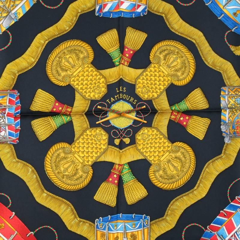 Brand New HERMES Scarves consists of 100% silk material in a black (multi-color) tone. Designed with title 'LES TAMBOURS