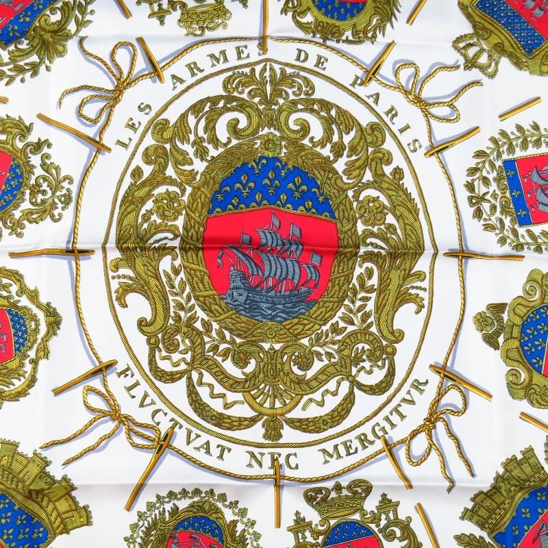 Brand New HERMES Scarves consists of 100% silk material in a white (multi-color) tone. Designed with signature pipe roll along edges in gold tone, 