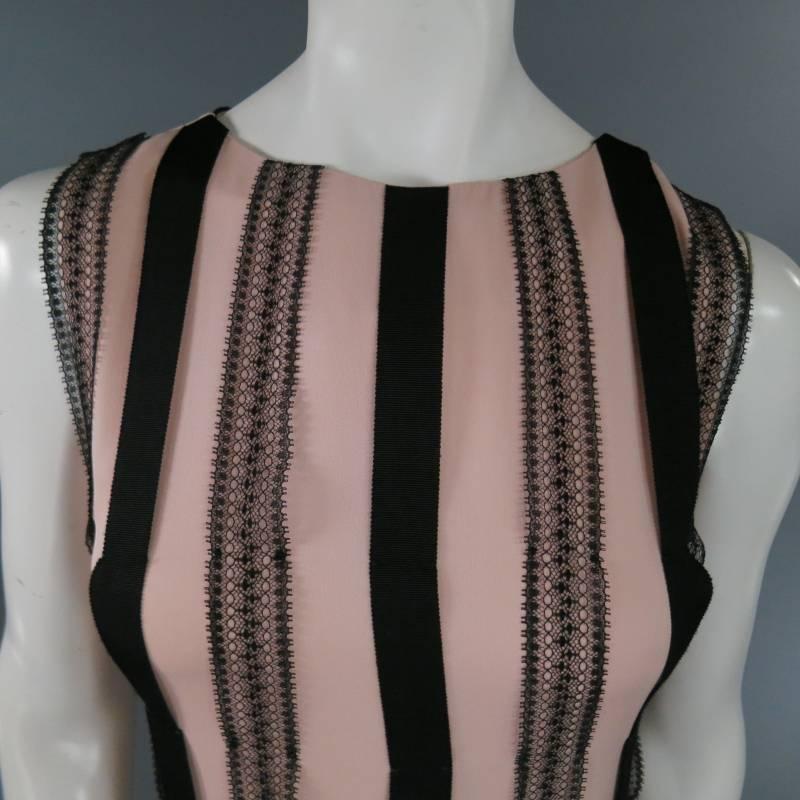 This gorgeous BEHNAZ SARAFPOUR dress comes in a soft rose pink silk and features a high crew neck, drop waist pleated skirt, and black ribbon and lace all over stripe embellishments. Made in The USA.
 
Very Good Pre-Owned Condition.     Marked:
