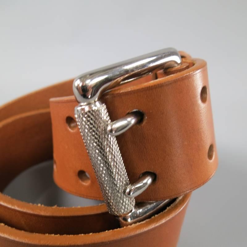 This RALPH LAUREN belt features a light brown thick belt and high shine silver tone double prong buckle. Made in Italy.
 
Excellent Pre-Owned Condition.
 
Measurements:
 
Length: 39.5 in.
Width: 1.5 in.
Fits: 30-36 in.

Item ID: 62290
