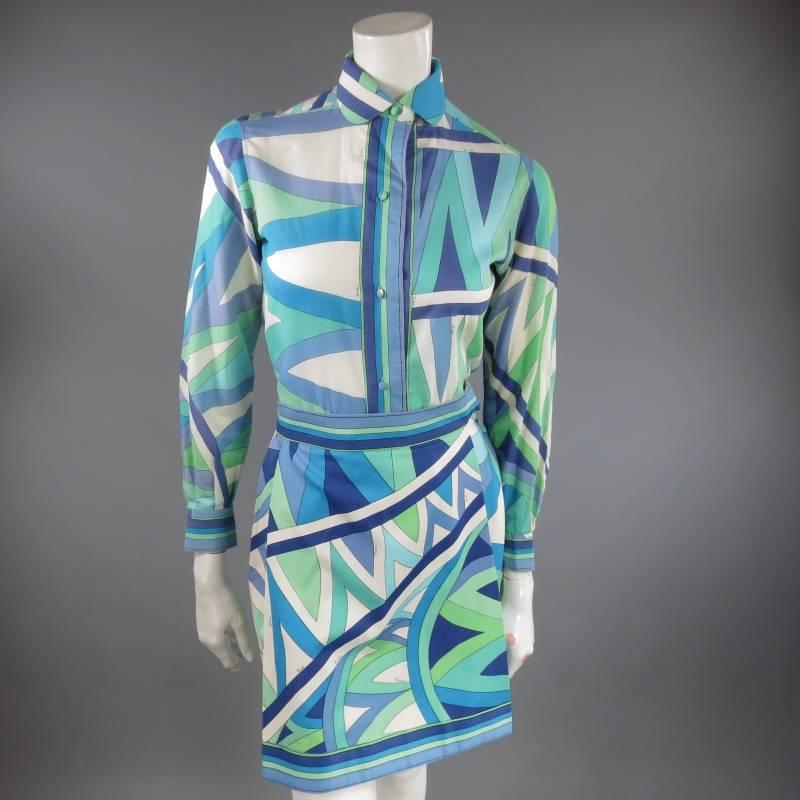 This gorgeous vintage EMILIO PUCCI blouse comes in a signature print sheer cotton with striped piping and features a peter pan collar and fabric covered buttons. Matching skirt sold separately. Made in Italy.
 
Very Good Pre-Owned Condition.    