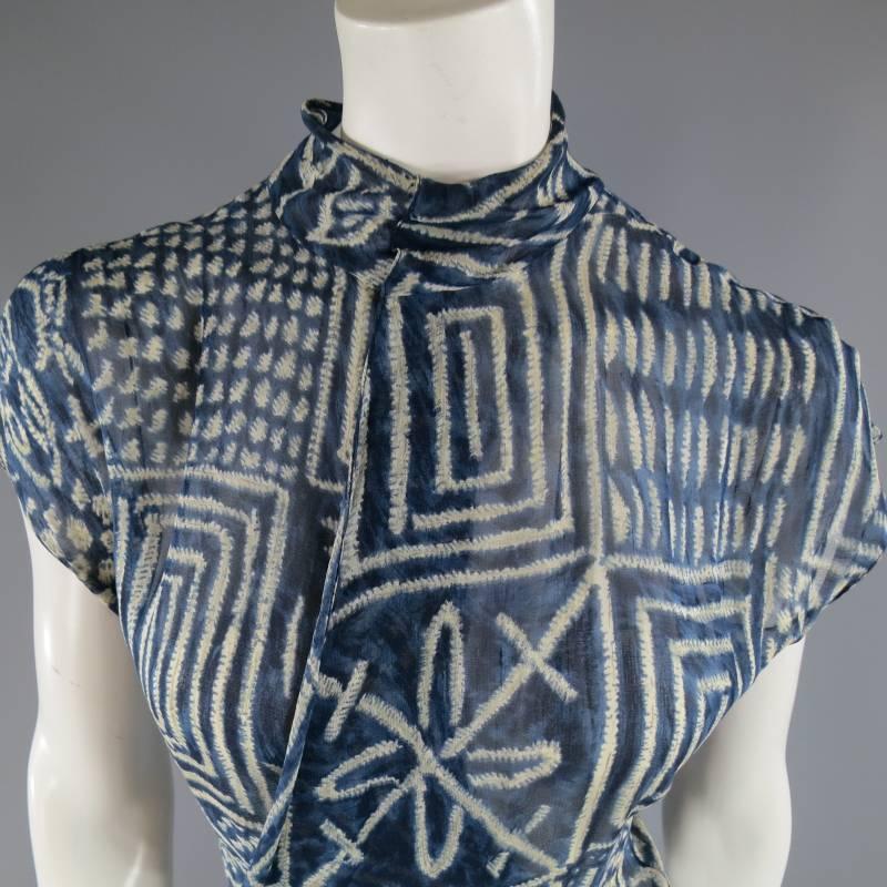 This fabulous RALPH LAUREN Collection maxi wrap dress comes in a tribal print silk chiffon and features a wrap and tied side, high snap collar, and ruffled hem. Made in USA.
 
Excellent Pre-Owned Condition.
Marked: 8
 
Measurements:
