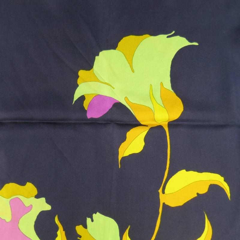 This vintage CHRISTIAN DIOR scarf comes in navy silk twill with raw edges and vibrant yellow gold, mint green, orchid purple, and pink floral graphic print. In great condition with some major discolorations shown in detail shots.
 
Good Pre-Owned