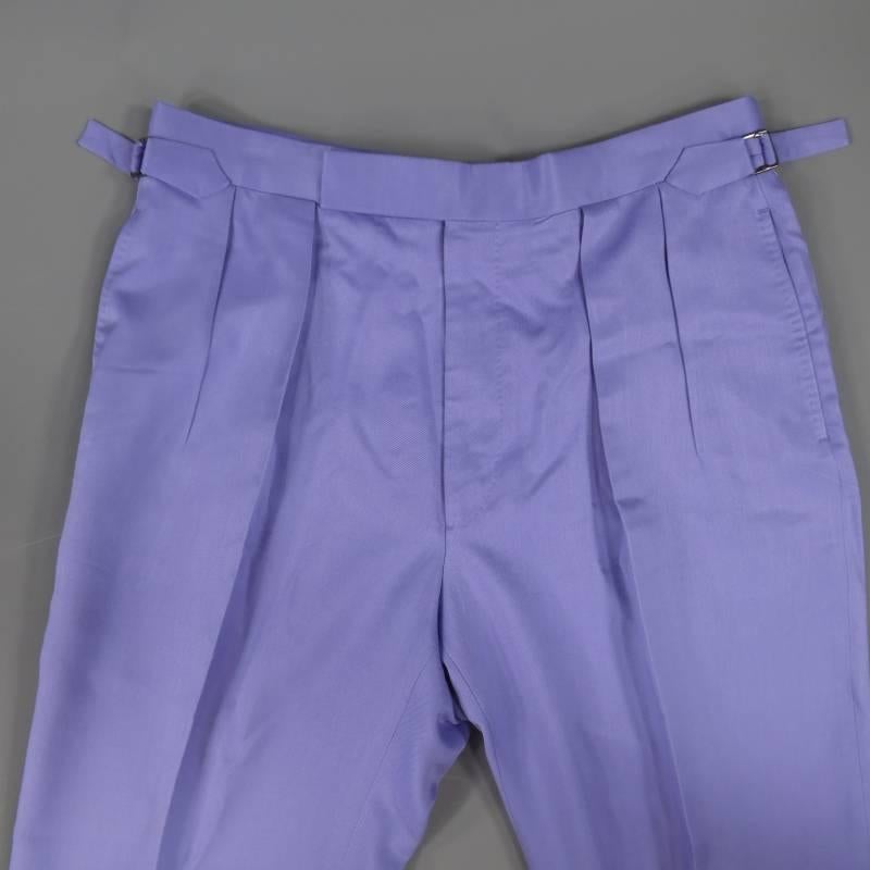 These Brand New RALPH LAUREN PURPLE LABEL dress pants come in a light weight pastel lavender purple silk twill and feature a double pleated front, hook eye placket closure, adjustable side belts, and come unhemmed. Made in Italy.
 
Brand New With