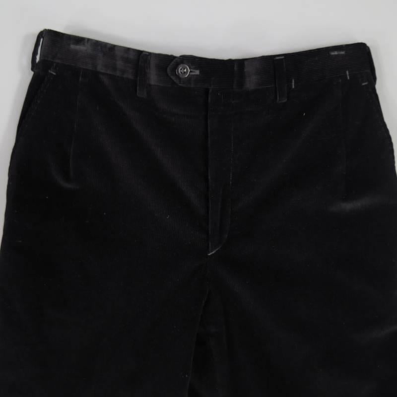 These classic BRIONI pants come in jet black thick ribbed corduroy with frontal darts and a cuffed hem. Made in Italy.
 
Good Pre-Owned Condition.
Marked: 32
 
Measurements:
 
Waist: 32 in.
Rise: 10 in.
Length: 30 in.
