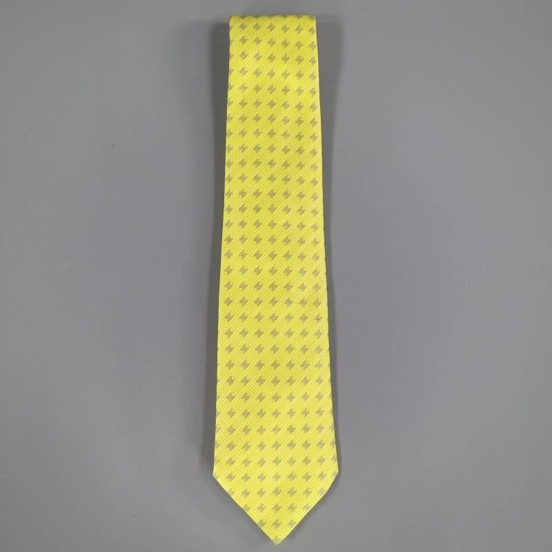 HERMES Tie consists of 100% silk material in a yellow color tone. Designed with signature 