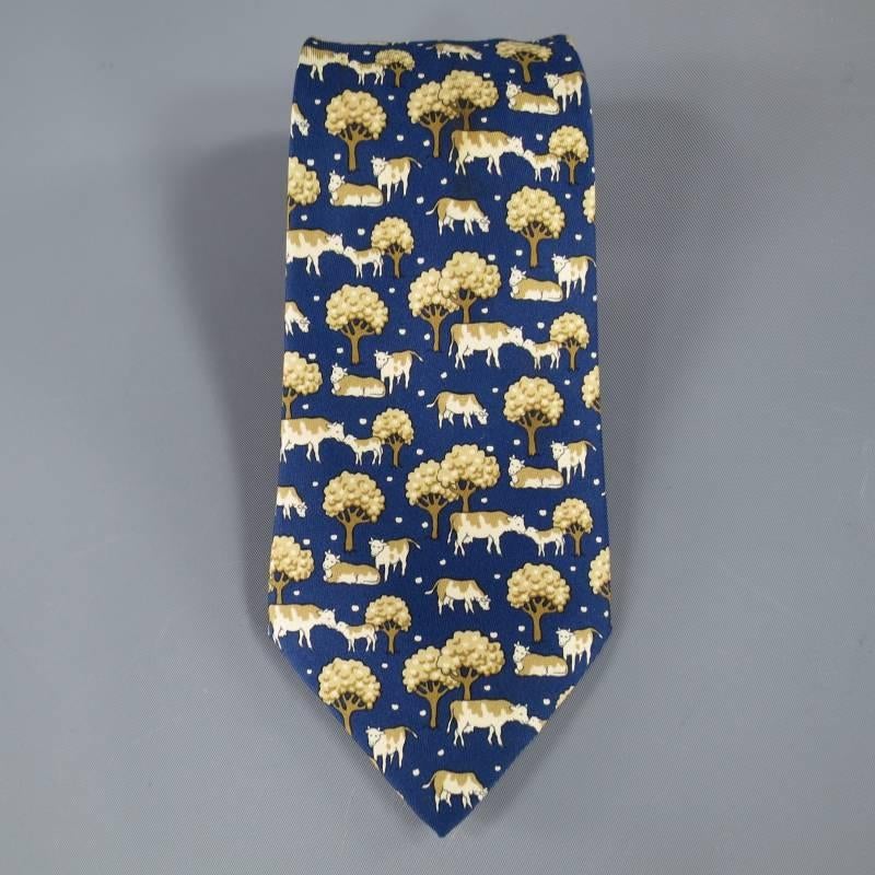 HERMES Tie consists of 100% silk material in a navy and gold color tones. Designed with cow and tree print throughout body of tie. Made in France.

Excellent Pre- Owned Condition.

 Marked Size: 7527 IA
  
Marked As: 7527 IA
