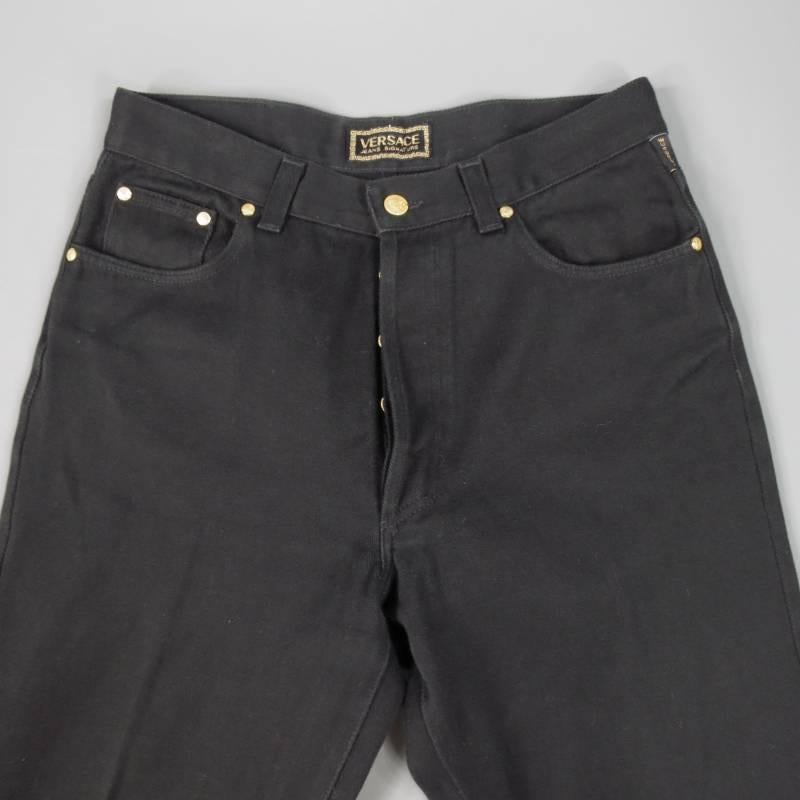 VERSACE JEANS consists of 100% cotton material in a black color tone. Designed with a button-fly opening, tone-on-tone stitching throughout body. Versace gold buttons detail mid-section. Relaxed leg. Made in Italy.
 
Good Pre-Owned