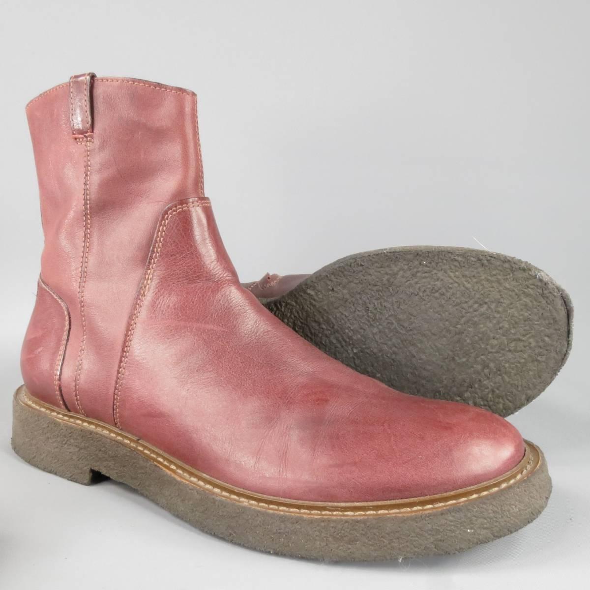 Maison Martin Margiela Boots consists of leather material in a burgundy color tone. Designed with a high collar, round toe front, side zipper opening, contrast stitching along vamp section and back of heel. Thick crepe rubber sole with heel. Made in