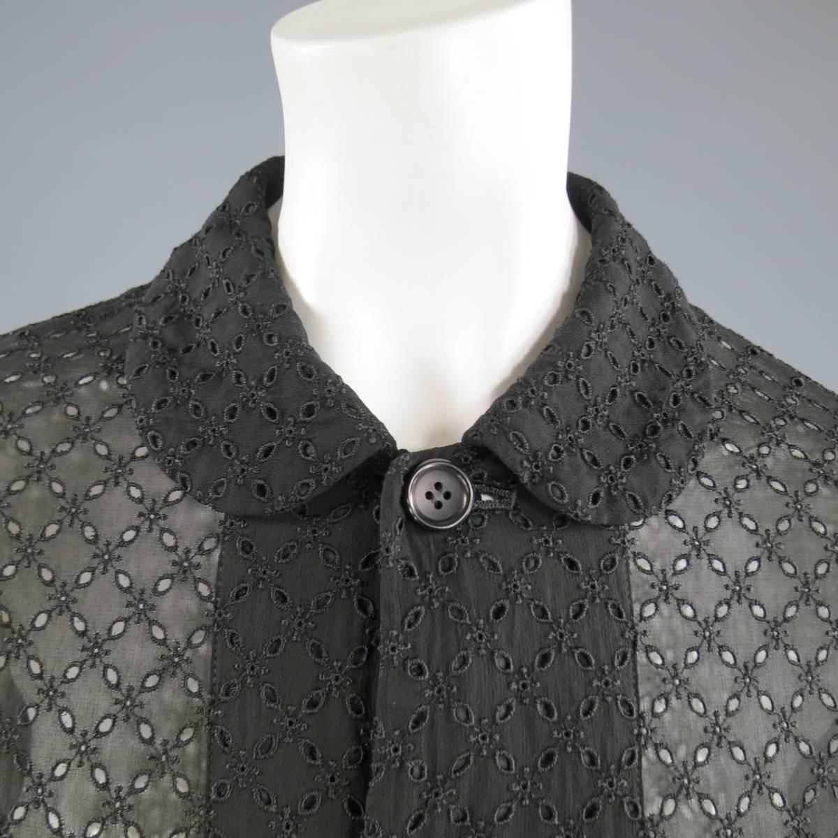 This COMME DES GARCONS jacket comes in a sheer black cupro with emboidered cutout pattern throughout and features a button up front, Peter Pan rounded collar, and cut pocket accent. Made in Japan.
 
Very good Pre-Owned Condition.
Marked: M
