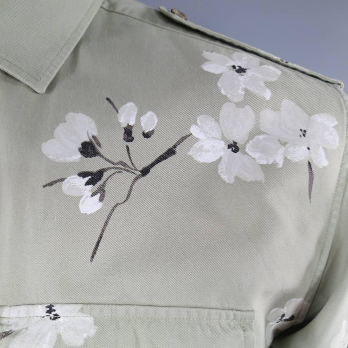 TOM FORD for GUCCI long sleeve button down dress shirt features a minimal collar, two breast pockets, epaulettes and abstract floral cherry blossom design throughout in muted olive.
 
Excellent Pre-Owned Condition
 
 
Measurements:
