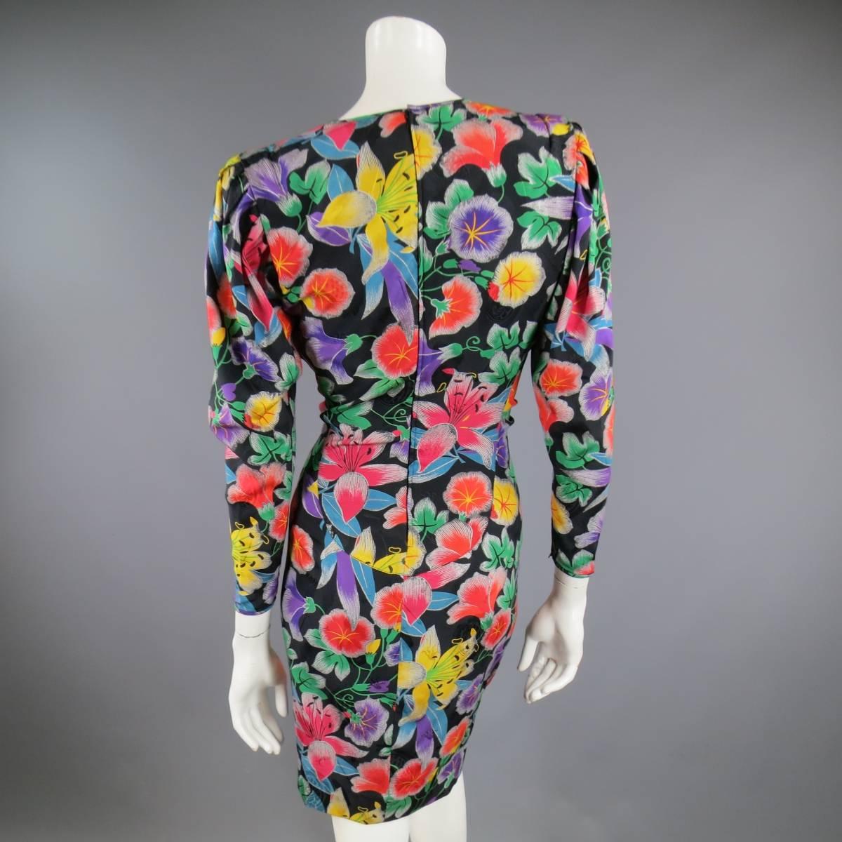 This fabulous vintage EMANUAL UNGARO dress comes in a vibrant multi-color floral on black printed silk and features a V neck, strong, padded shoulder, pleated sleeves, and unique ruched front. Made in Italy.
 
Excellent Pre-Owned Condition.
