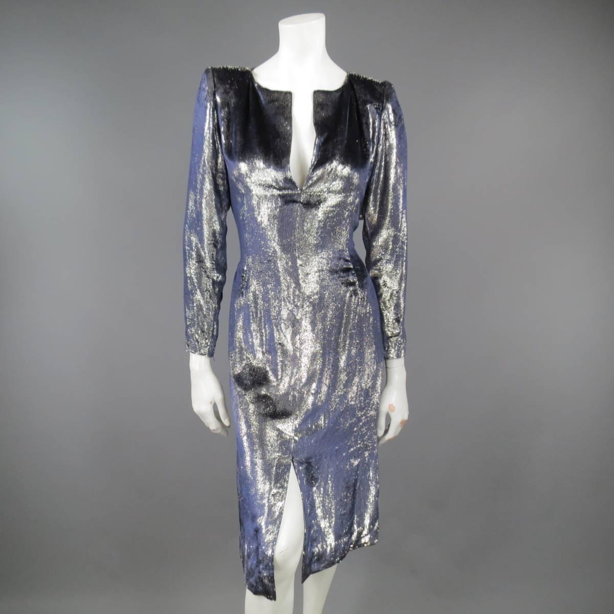 This fabulous vintage JEAN-LOUIS SCHERRER for Wilkes Bashford cocktail dress comes in a high shine silver foil navy velvet material and features a slit V neck, padded shoulders, long sleeve with zip closure, back zip, and frontal slit. Made in