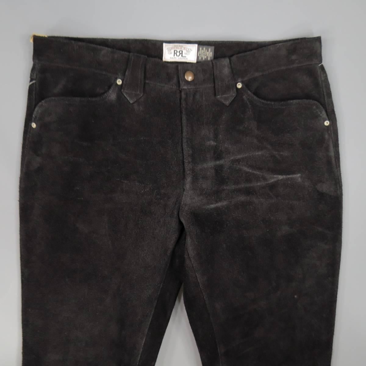 RRL by RALPH LAUREN Casual Pants consists of 100% suede material in a black color tone. Designed with a zip-fly button closure, quarter side pockets, tone-on-tone stitching throughout body. Western style detail, fringe edging toward leg hemming with