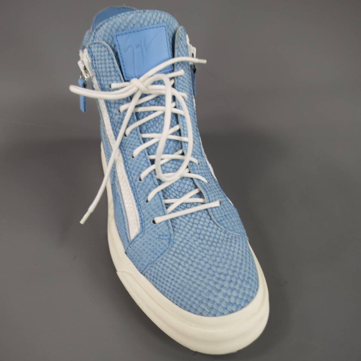 These rare GIUSEPPE ZANOTTI hi-top sneakers come in a light powder blue, snake skin textured embossed leather with double white zip front, lace up, Embossed logo tongue, back zipper detail, and thick white rubber sole. With Box. Made in Italy.
