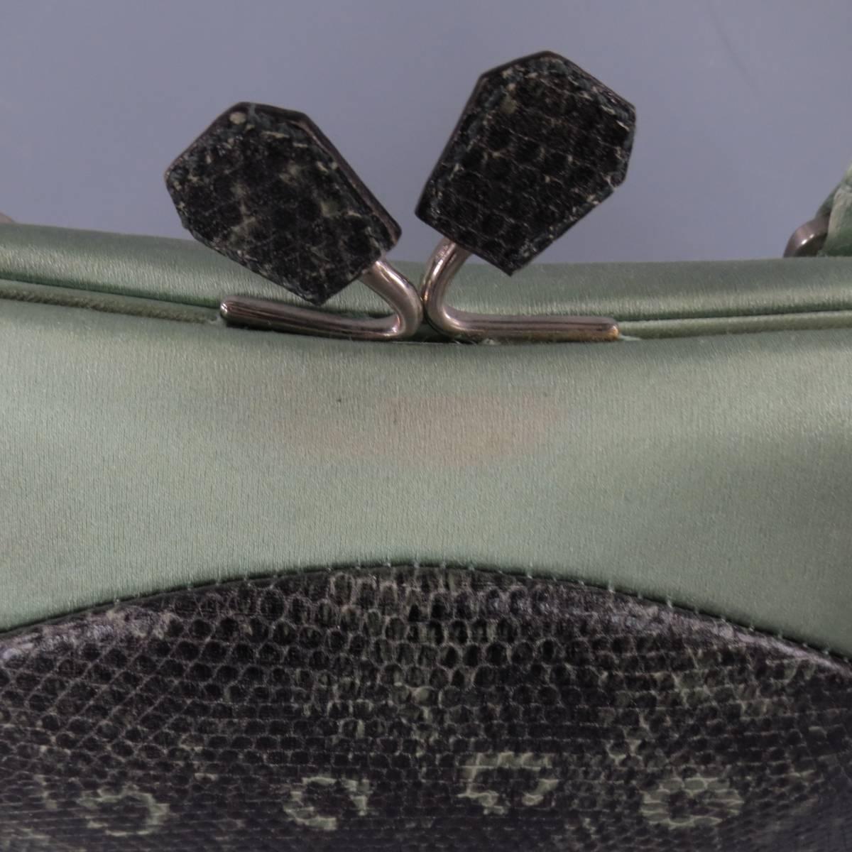 This cute mini PRADA retro inspired purse comes in a gorgeous mint green satin with mating lizard leather body, satin piping, enamel plaque, and kiss lock closure. In great condition with minor discoloration. Includes dust bag and authentication