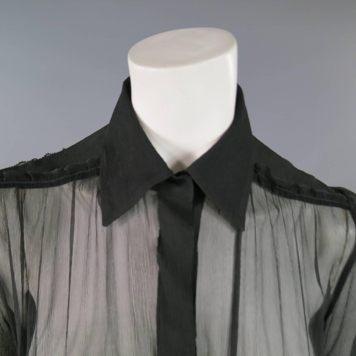 This fabulous JEAN PAUL GAULTIER blouse comes in sheer black textured chiffon with a pointed collar, snap closure raw edge ruffle trim, and elastic cinched waist with ruched tulle and satin bow details.  Made in Italy.
 
Excellent Pre-Owned
