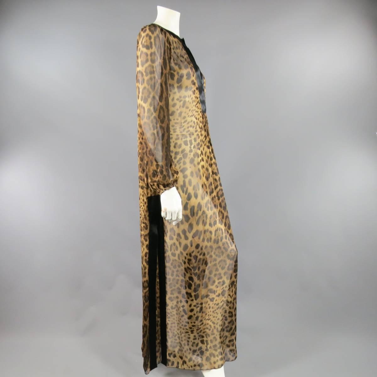 This gorgeous DOLCE & GABBANA maxi kaftan dress comes in flowing sheer leopard print chiffon with long puff sleeves, black chiffon trim, pleated front panel, and side slits. Missing tags. Made in Italy. Retails at $2350.00.
 
Excellent Pre-Owned