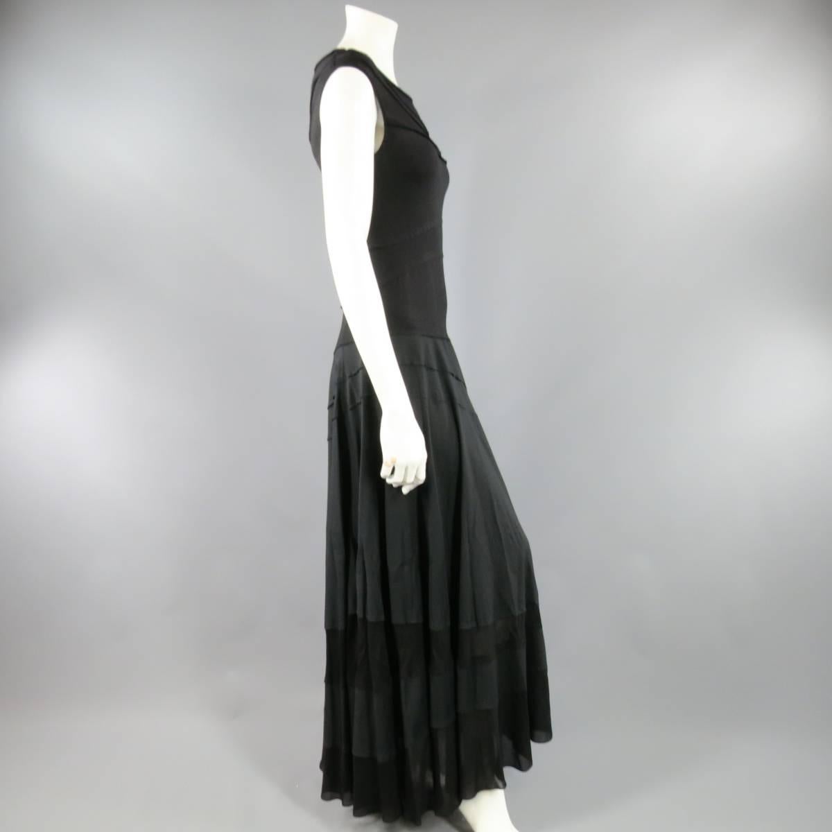 This gorgeous DONNA KARAN maxi dress features a sleeveless, boat neck top in sheer and opaque striped patch work stretch jersey panels with a matte satin and sheer asymmetrical patchwork circle maxi skirt. Made in The USA.
 
Excellent Pre-Owned