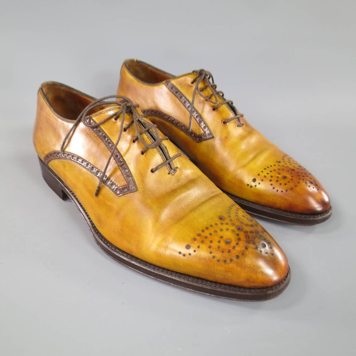 These BONTONI dress shoes come in multi tonal tan and brown washed effect leather featuring a pointed toe with brogue details. With Box. Made in Italy Retails at $1050.00.
 
Good Pre-Owned Condition.
Marked: 10
 
12.45 x 4.25 in.
