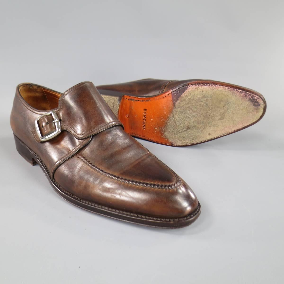 These BONTONI dress shoes come in tonal brown leather with a pointed top stitch toe and thick monk strap with buckle. With Box. Made in Italy. Retails at $1050.00.
 
Good Pre-Owned Condition.
Marked: 10
 
12 x 4 in.