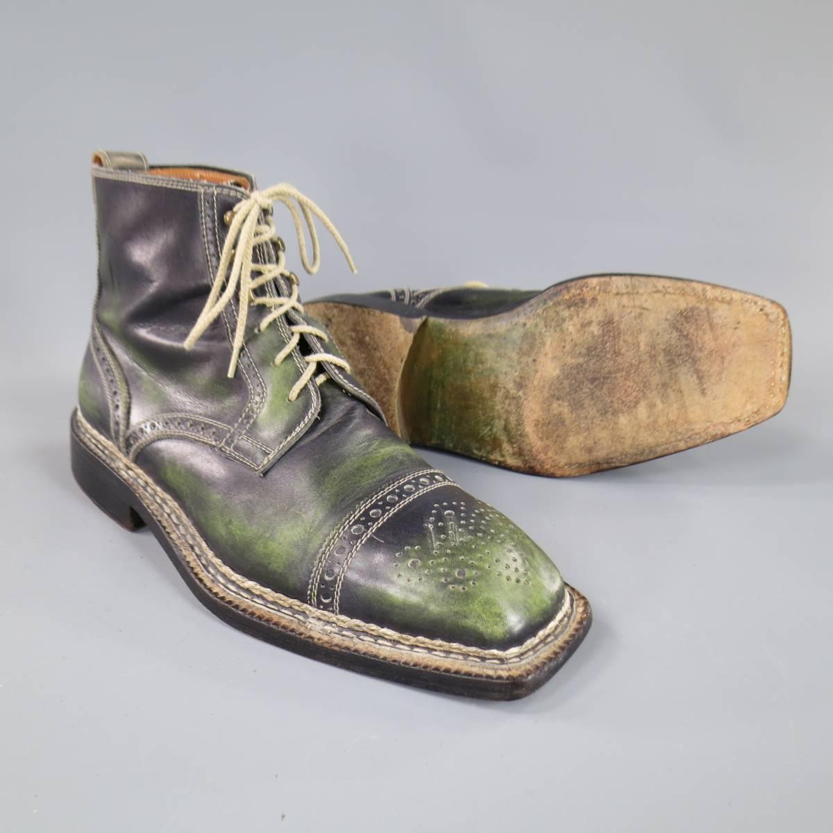 These funky BETTANIN & VENTURI ankle boots come in a unique black and green distressed treated leather and feature a square cap toe with brogue detail, brogue piping, and black heeled sole with contrast stitching. Made in Italy.
 
Good Pre-Owned
