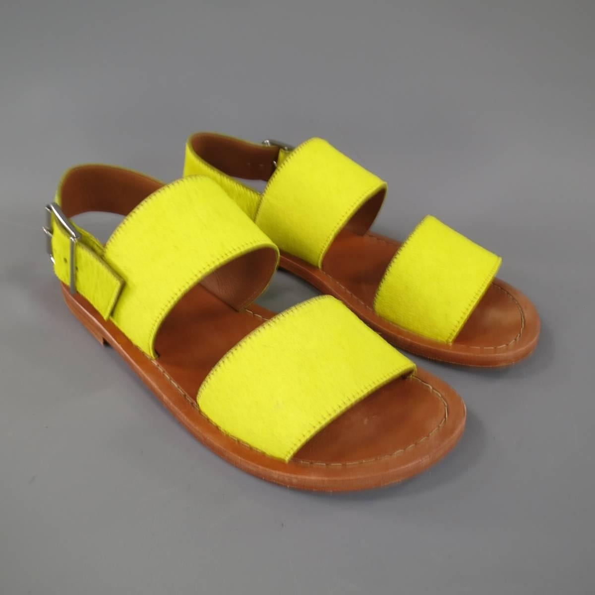 These rare MARNI sandals come in bright yellow pony hair leather and features two thick straps, ankle strap closure with silver tone oversized buckle, and tan leather sole.
 
Excellent Pre-Owned Condition.
Marked: 41
 
11 x 4.5 in.
