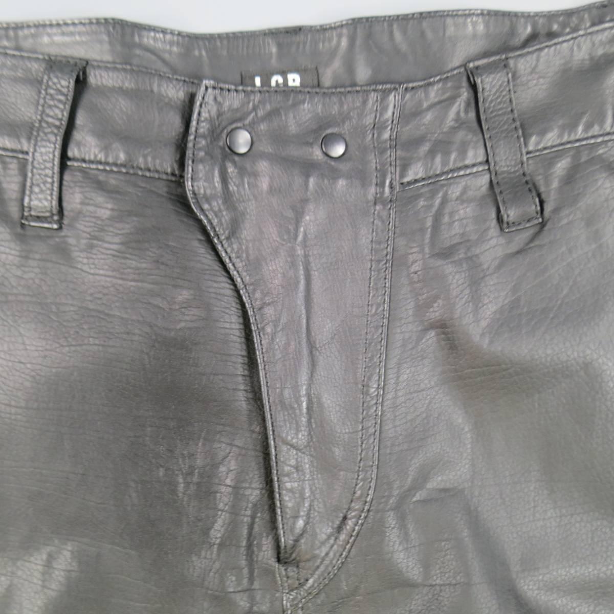 These cropped drop crotch pants by L.G.B. come in soft, light weight black leather with a snap closure front, suede under panel, snap pockets, side tabs, and ribbed band hem. Made in Japan.
 
Good Pre-Owned Condition.
Marked: 2
