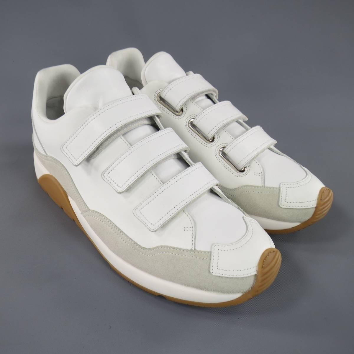 Brand New DIOR HOMME Sneakers consists of leather material in a white color tone. Designed in a round-toe front, velcro strap vamp-closure with tone-on-tone stitching along edges. Detailed with suede trim along sides in a light beige color and tan