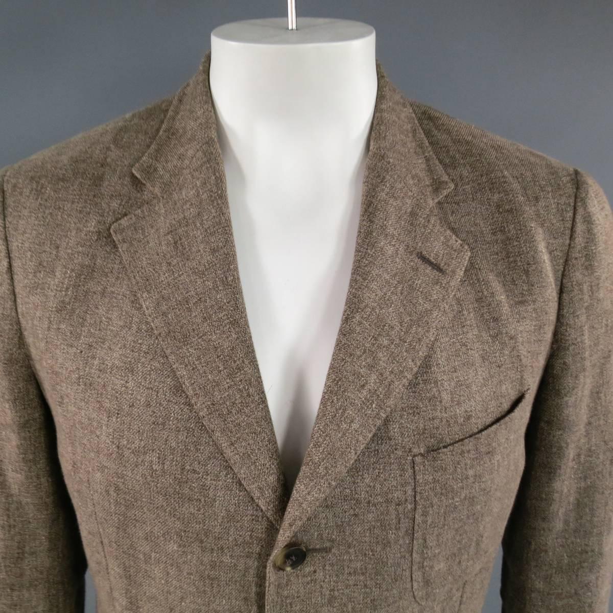 LORO PIANA Sport Coat consists of a linen/ cotton blend material  in a brown color tone. Designed with a notch lapel collar, 3-button front and bottom patch pockets. Detailed with a top patch pocket, 4-button cuff and double back vent. Heather