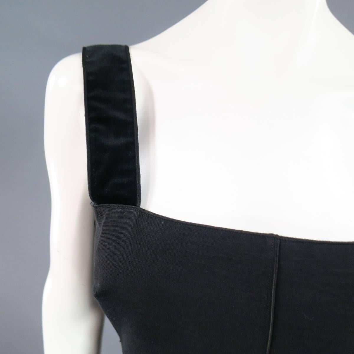 This lovely D&G by DOLCE & GABBANA top comes in black coated faille with embroidered trim, thick velvet straps, ribbon waist band, and box pleated peplum. Wear throughout fabric.
 
Fair Pre-Owned Condition.
Marked: 36
 
Measurements:
 
Bust: