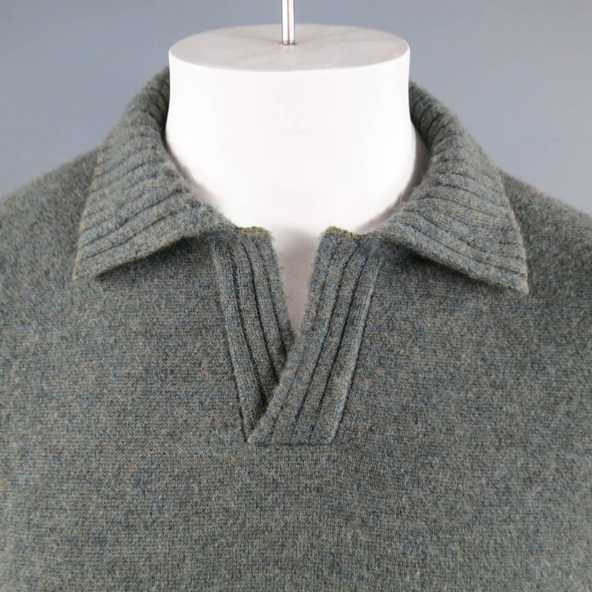 LORO PIANA Pullover consists of 100% cashmere material in a teal green color tone. Designed in a open collar, rib texture with cuff and hem patterning. Detailed with side ribbing going down and back collar suede trim.. Made in Italy.

Good